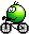 A green emoji riding a bicycle